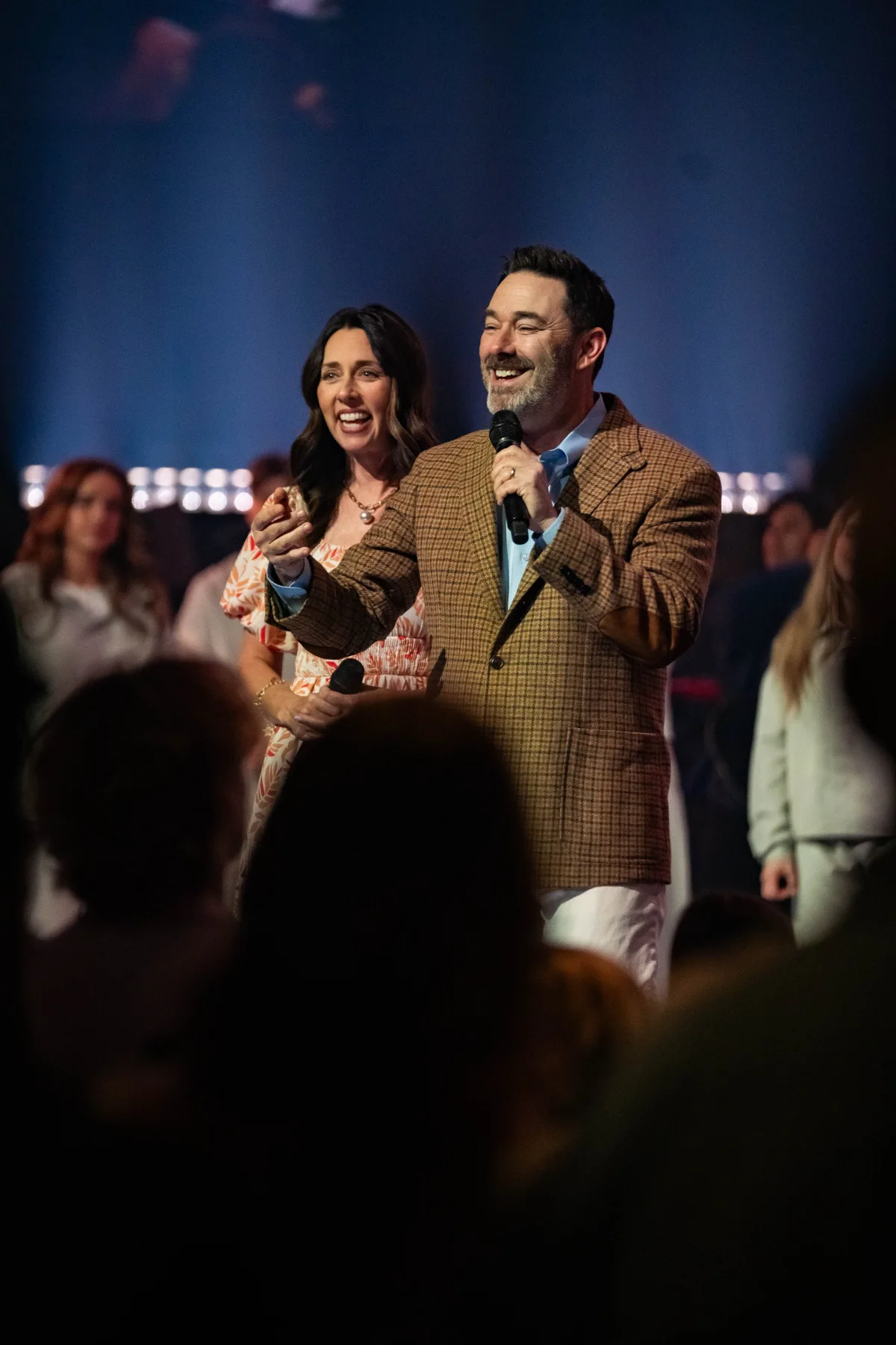 Brandon and Susan Thomas speaking on stage
