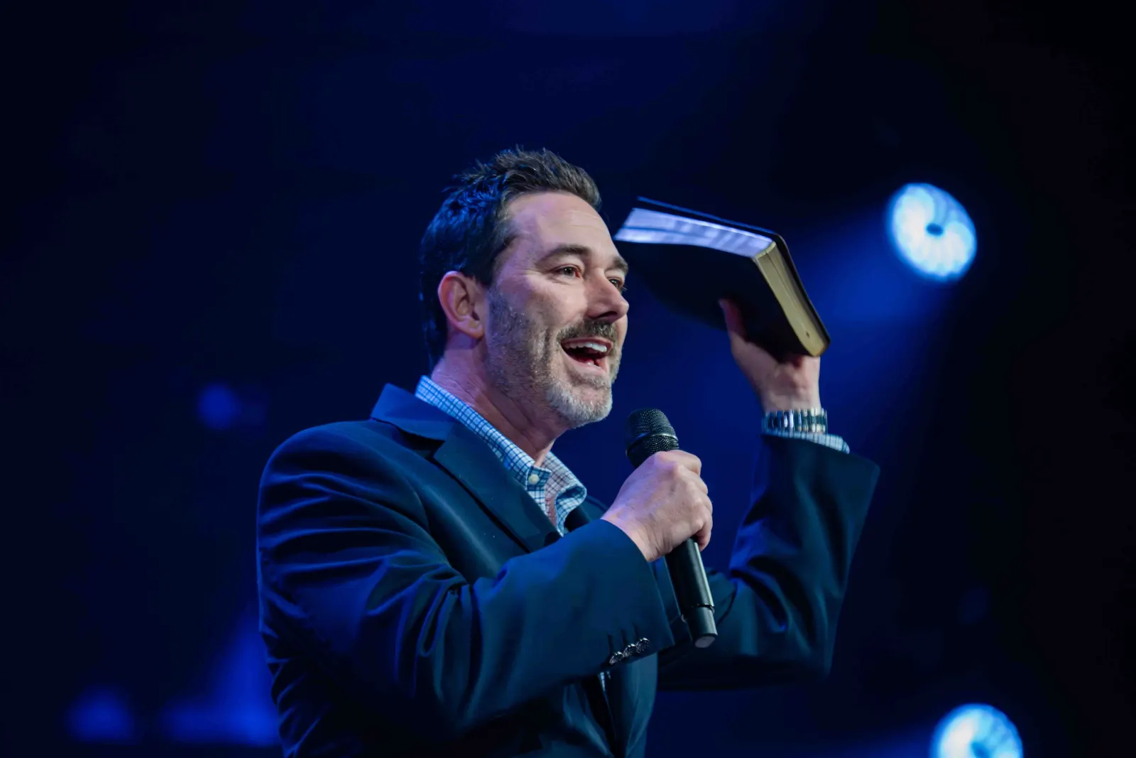 Brandon Thomas preaching with an open Bible
